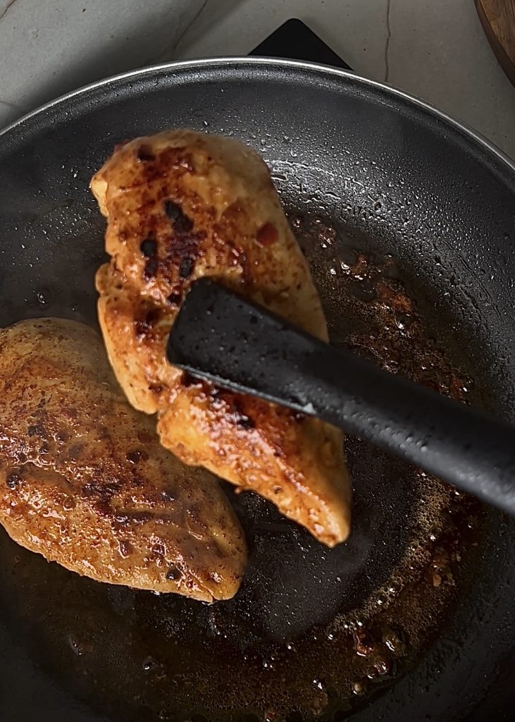 . Cook the Chicken
Heat oil in a large skillet. Season chicken with paprika, Italian seasoning, salt, and pepper. Cook until golden and set aside.