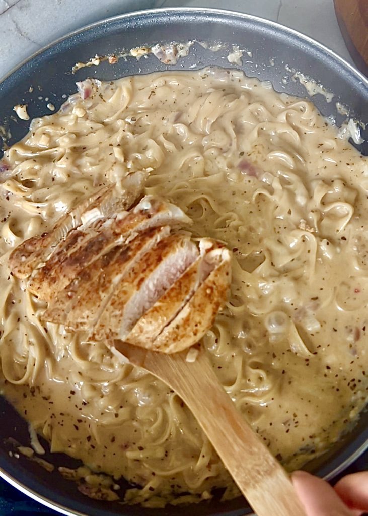 Finish the Sauce
Stir in Parmesan and cooked chicken. Simmer briefly to thicken.