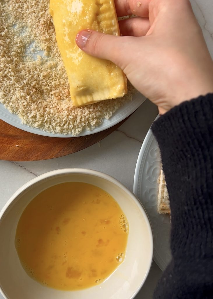 Coat and Fry
Dip each roll in beaten egg, coat with breadcrumbs, and fry until golden brown. Drain on paper towels before serving.