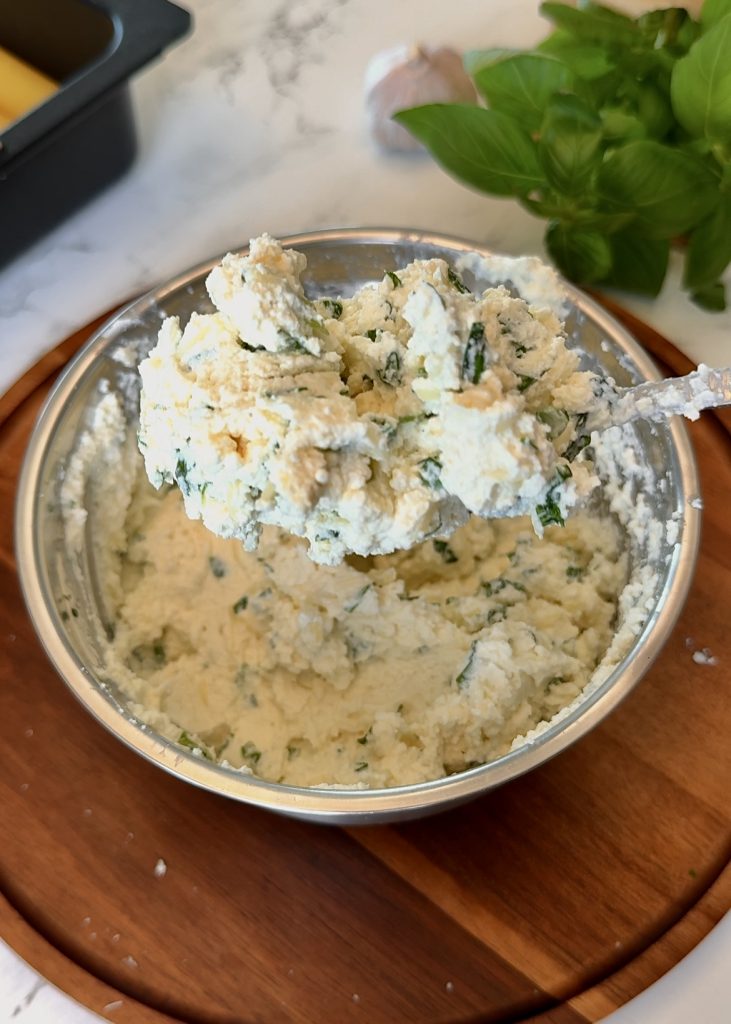 Prepare the Filling: Combine ricotta, cream cheese, mozzarella, Parmesan, basil, salt, and pepper until creamy.