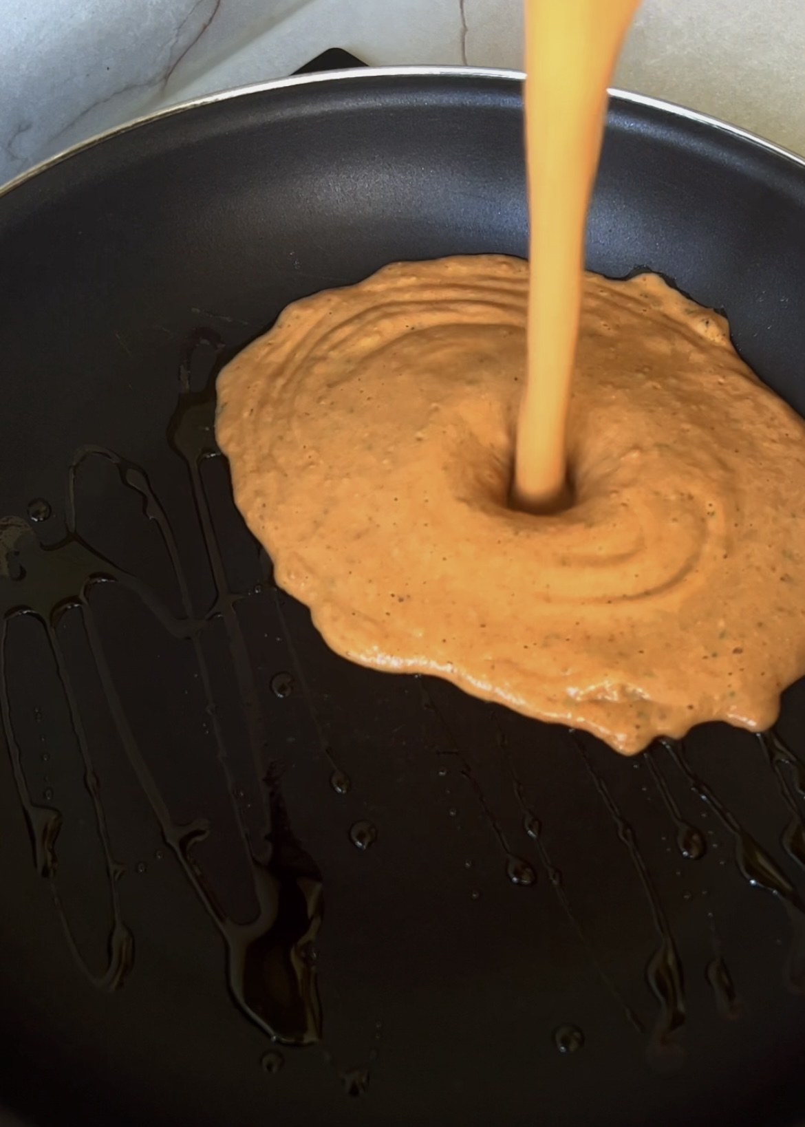 Blended roasted tomato and ricotta sauce poured into a pan