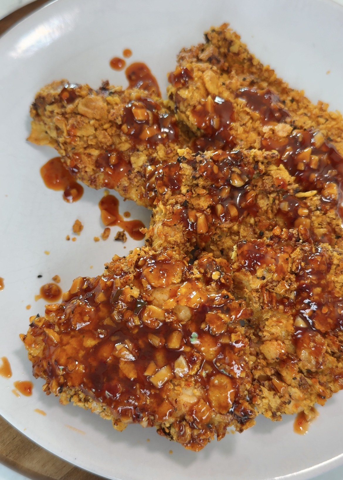 Cornflake chicken coated in honey garlic sauce