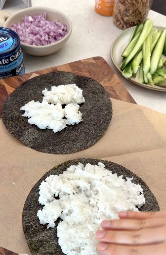Press sushi rice onto nori circles