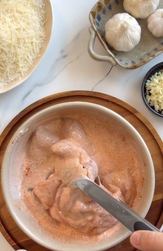 Chicken strips in seasoned buttermilk marinade