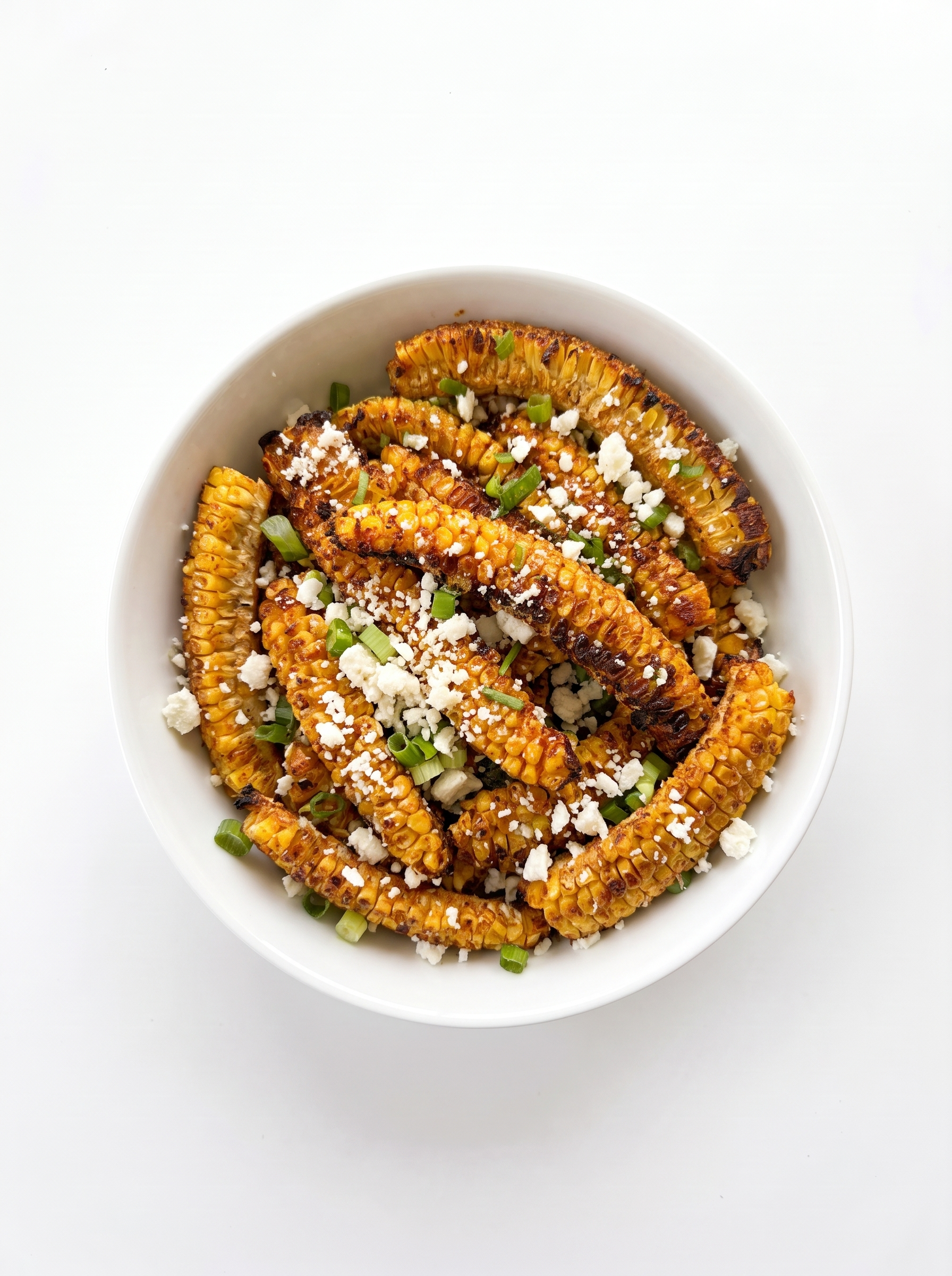 Roasted corn ribs with cheese and green onions