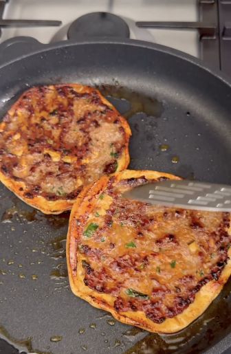 Cook the beef-topped flatbreads in a frying pan