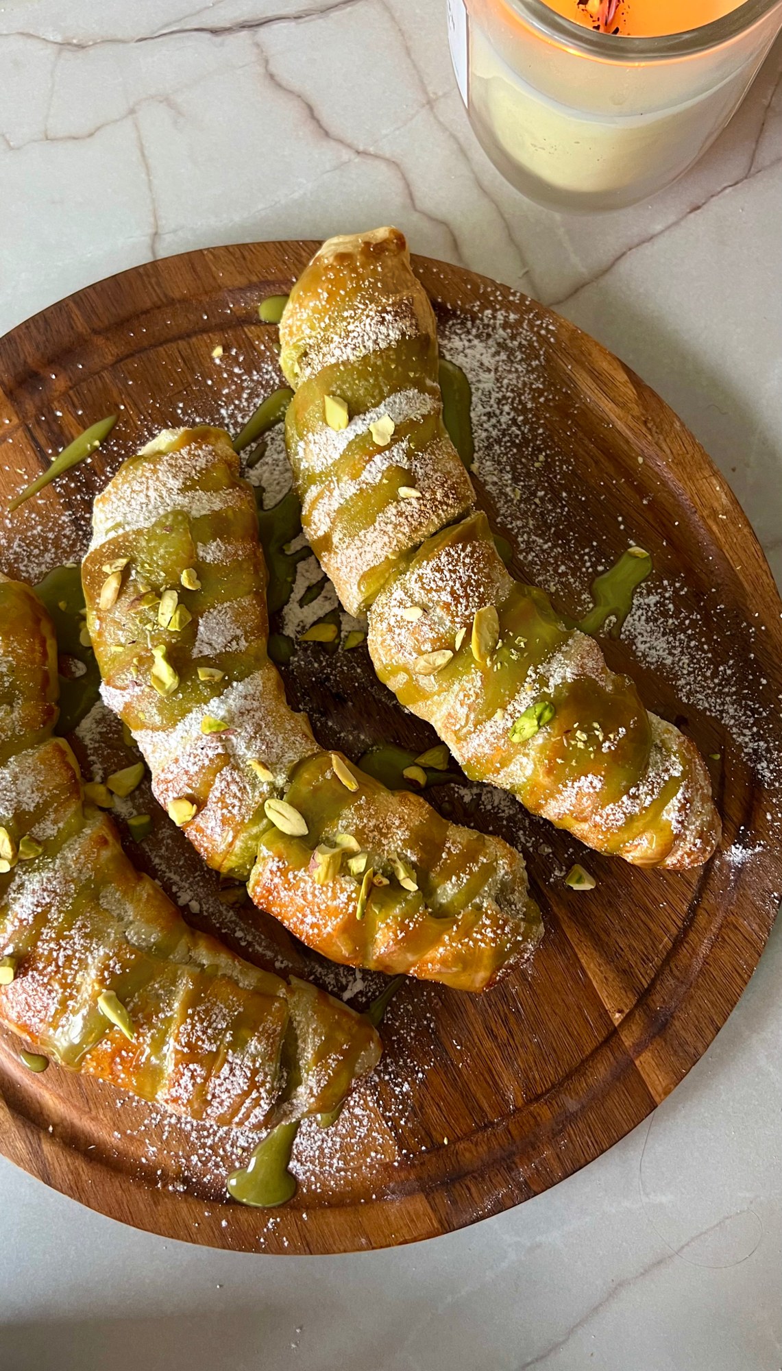 Golden puff pastry bananas with pistachio filling