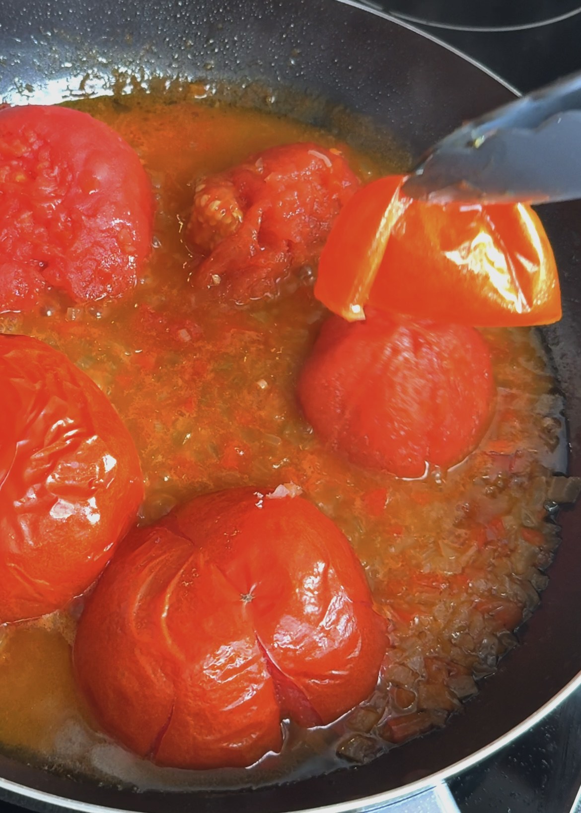 Softening fresh tomatoes and peppers in a skillet