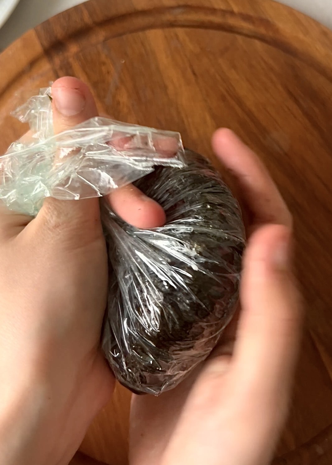 Wrapped sushi burgers resting before slicing