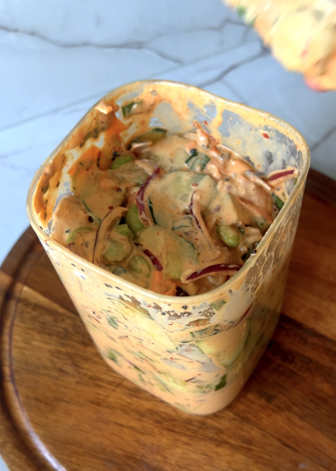 Sushi cucumber salad mixed with creamy spicy dressing