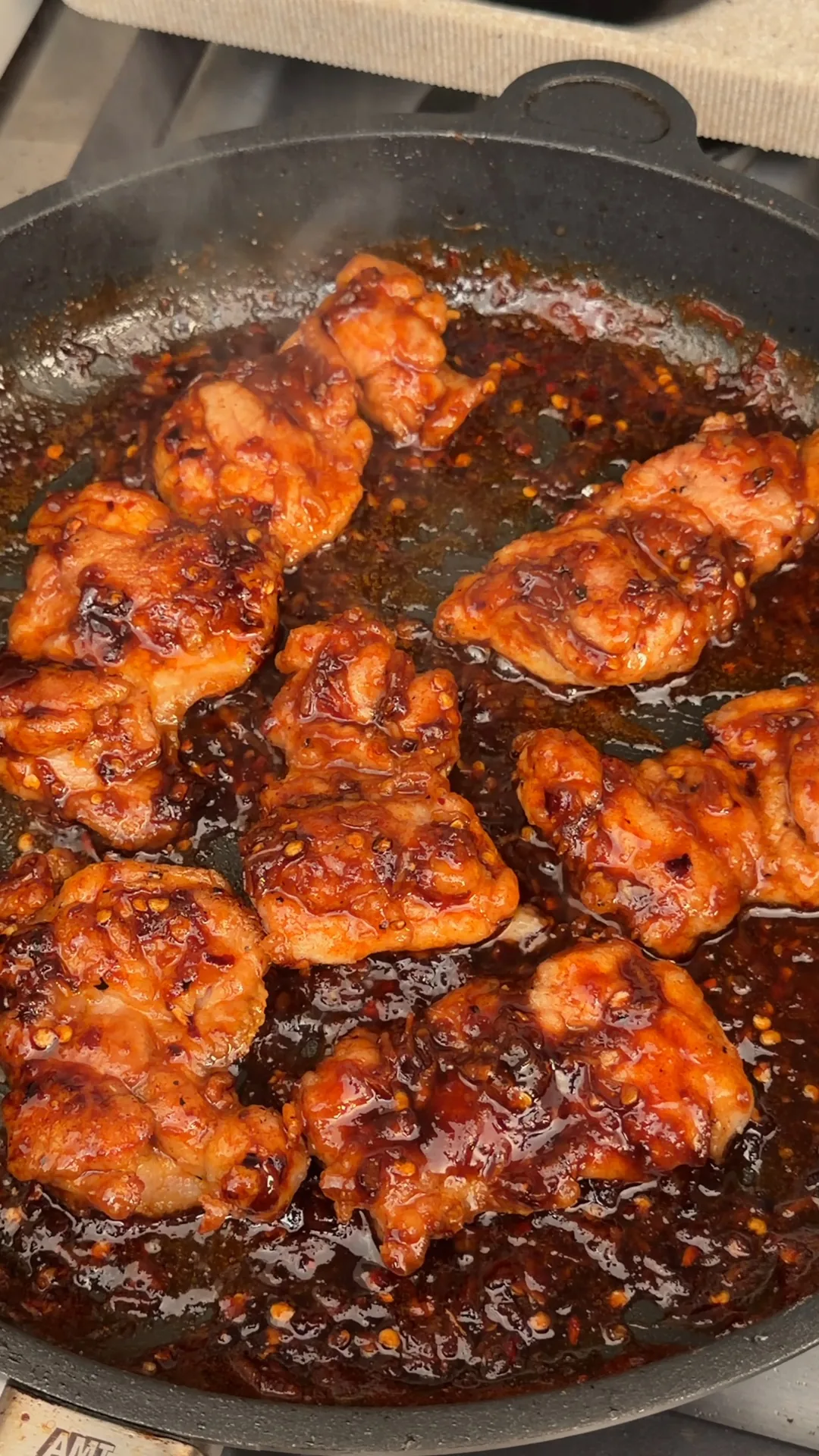 Chicken thighs coated in glossy honey lemon garlic sauce