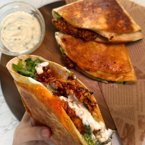 Crispy chicken burger folded wrap with cheddar and lettuce