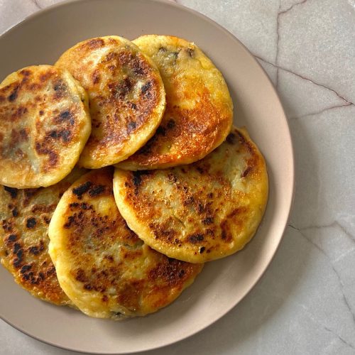Golden crispy potato pancakes filled with mushrooms, spinach and mozzarella