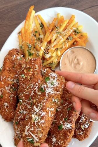 Garlic Parmesan chicken tenders with fries and dipping sauce