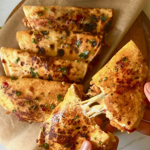 Crispy honey BBQ chicken tacos with melted cheese