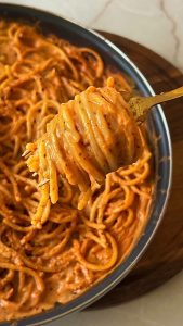 Pasta coated in creamy roasted tomato and ricotta sauce