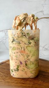 Creamy sushi cucumber salad with chicken and vegetables