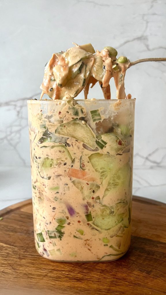 Creamy sushi cucumber salad with chicken and vegetables