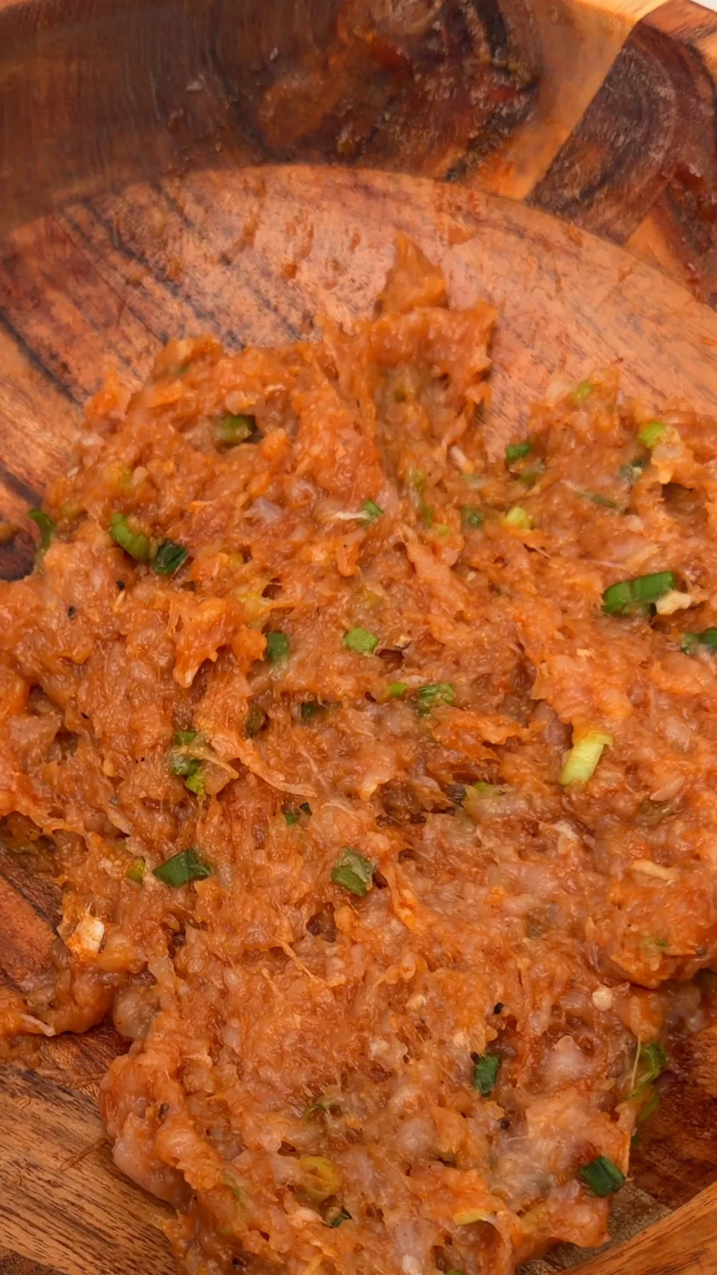 Ground chicken filling mixed with green onions and seasonings